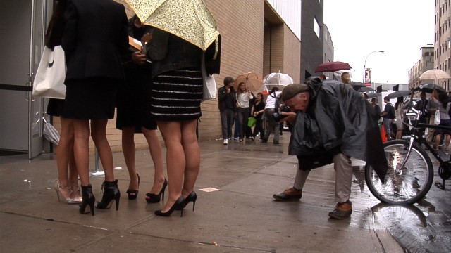 Bill Cunningham shooting women attending a fashion show in Chelsea during Fashion Week in New York City from the feature-length documentary, "Bill Cunningham New York," ( 2010),  directed by Richard Press and produced by Philip Gefter.  TO BE USED ONLY WITH PRESS AND PROMOTIONAL COVERAGE OF THE FILM. NOT TO BE USED FOR ANY OTHER PURPOSE WITHOUT PERMISSION FROM THE FILMMAKERS credit: First Thought Films Contact Philip Gefter: philipgefter@gmail.com